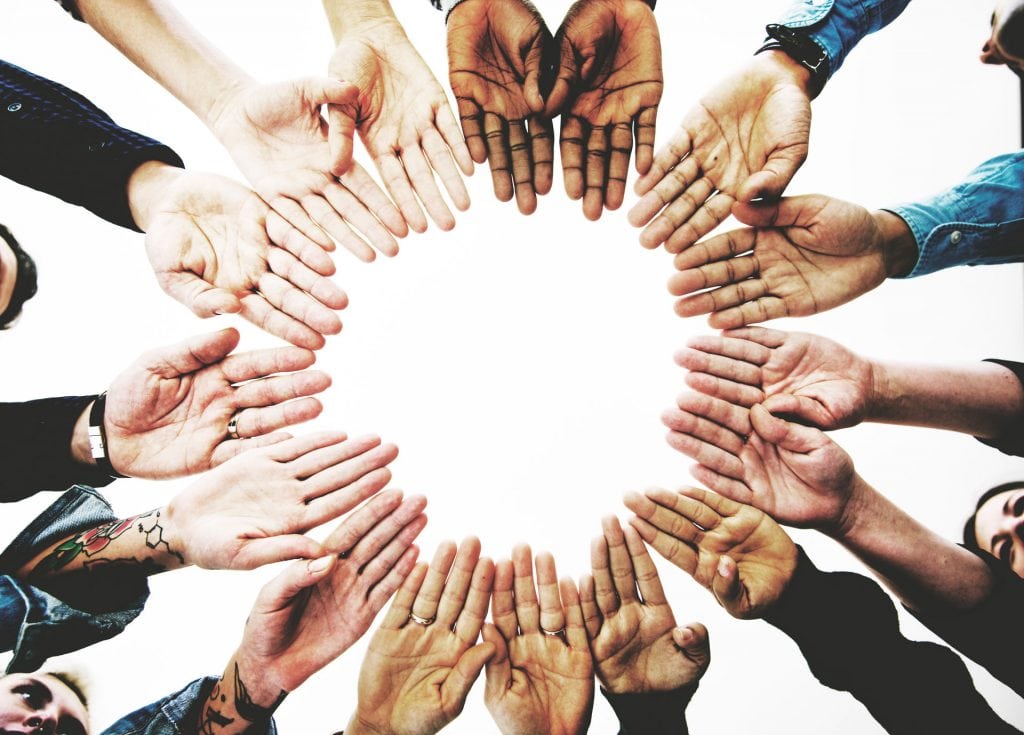 diverse-people-hands-together-partnership-P5VZKPZ